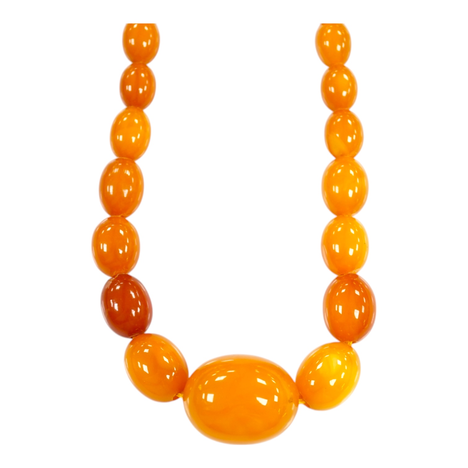 A single strand graduated oval amber bead necklace, 66cm, gross weight 48 grams. Condition - poor to fair